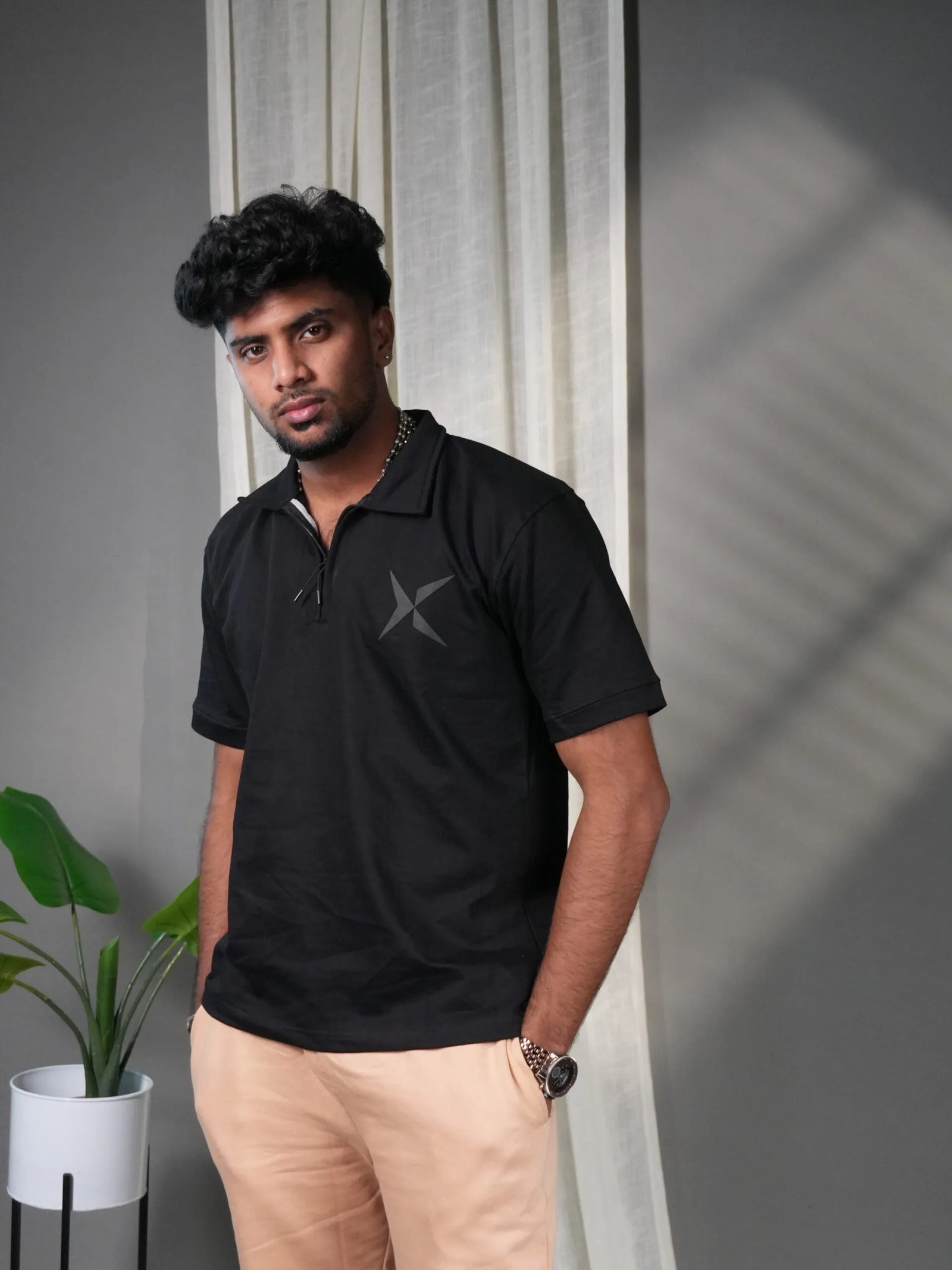 Man wearing black polo T-Shirt